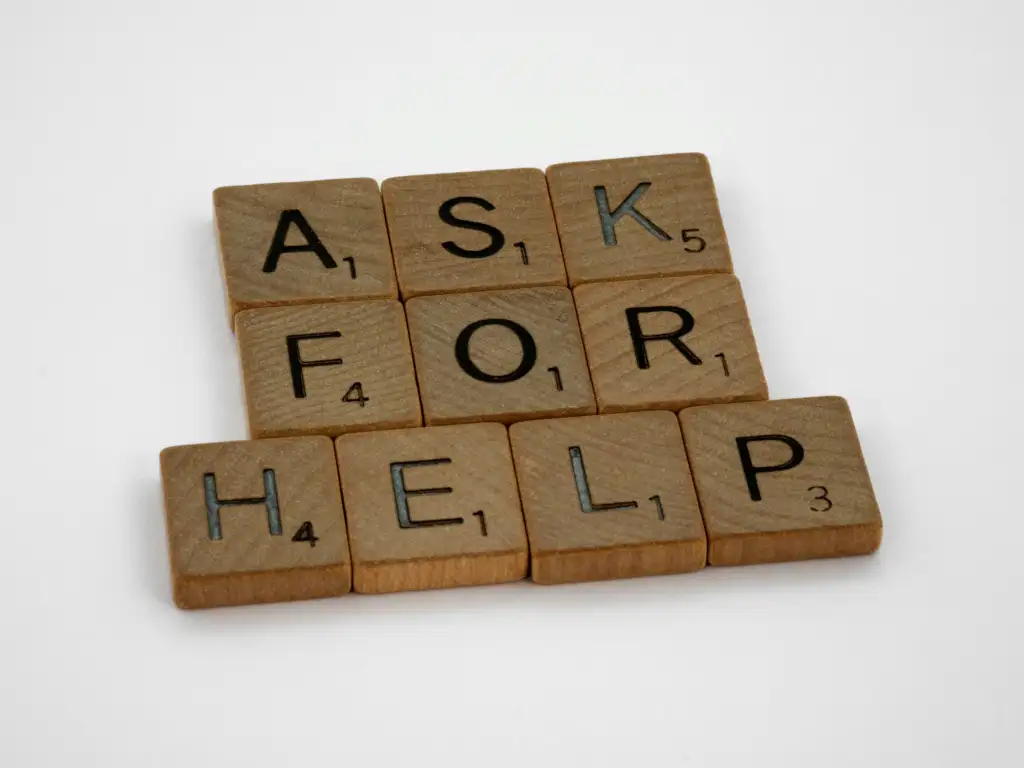 Tiles spelling "Ask for help"