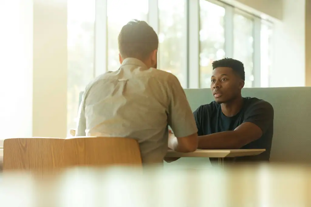 Two people talking together.